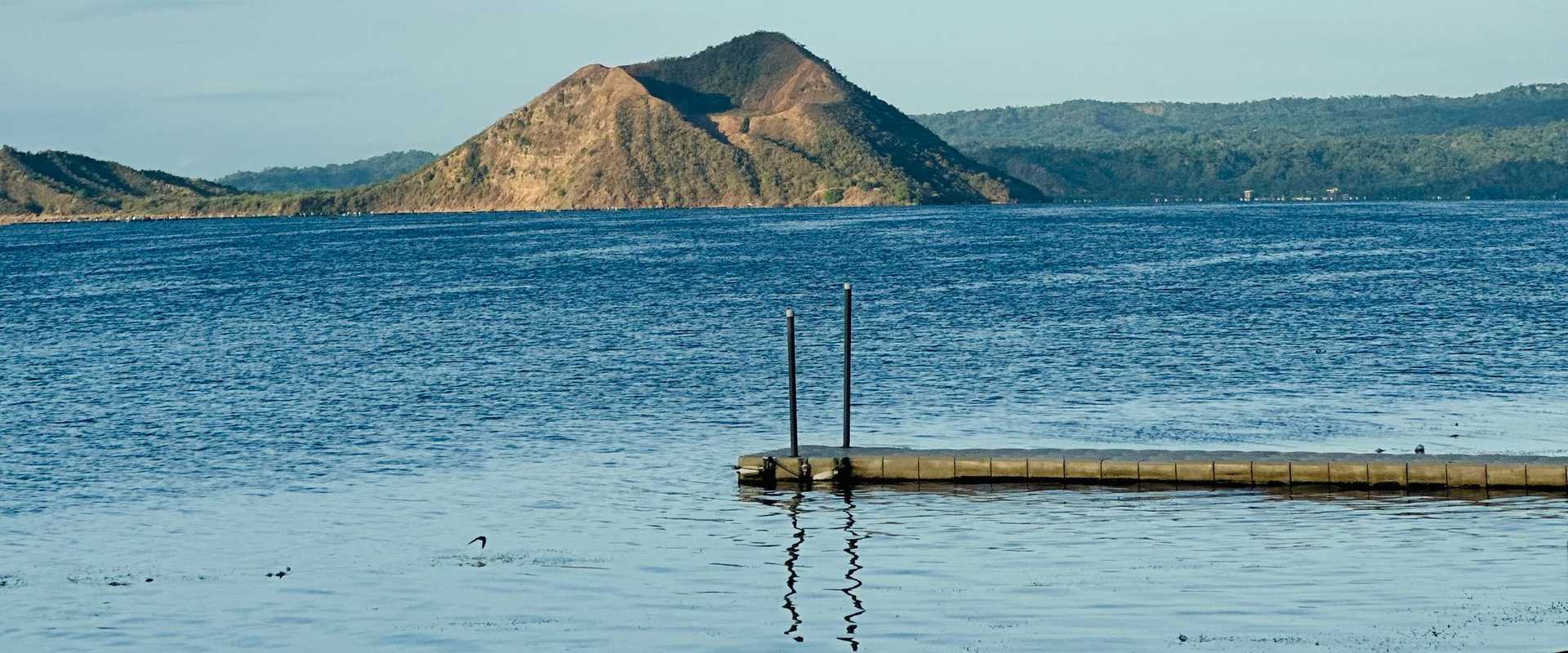 Taal Volcano island rising from Taal Lake, seen from Talisay