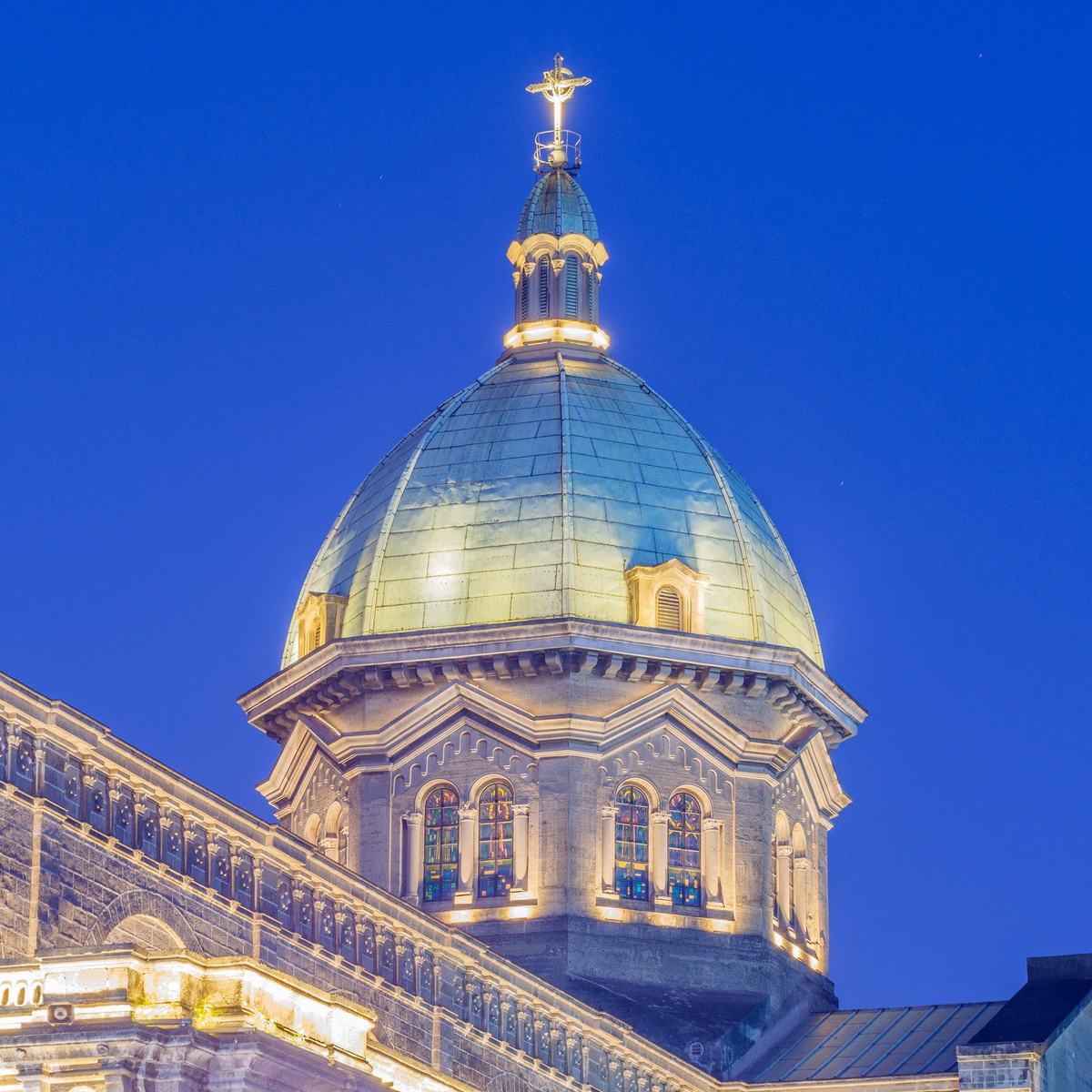 The lit dome of Manila Cathedral at dusk