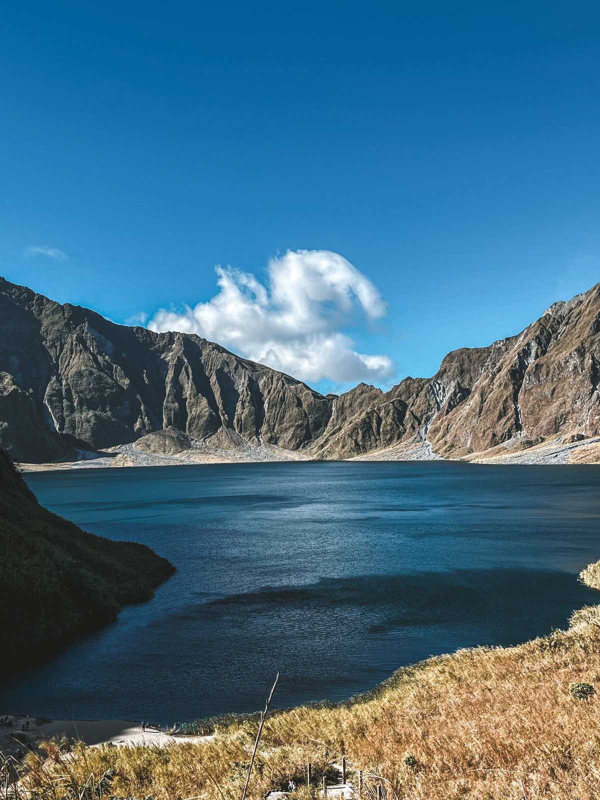 The crater lake of Mount Pinatubo below its rocky rim