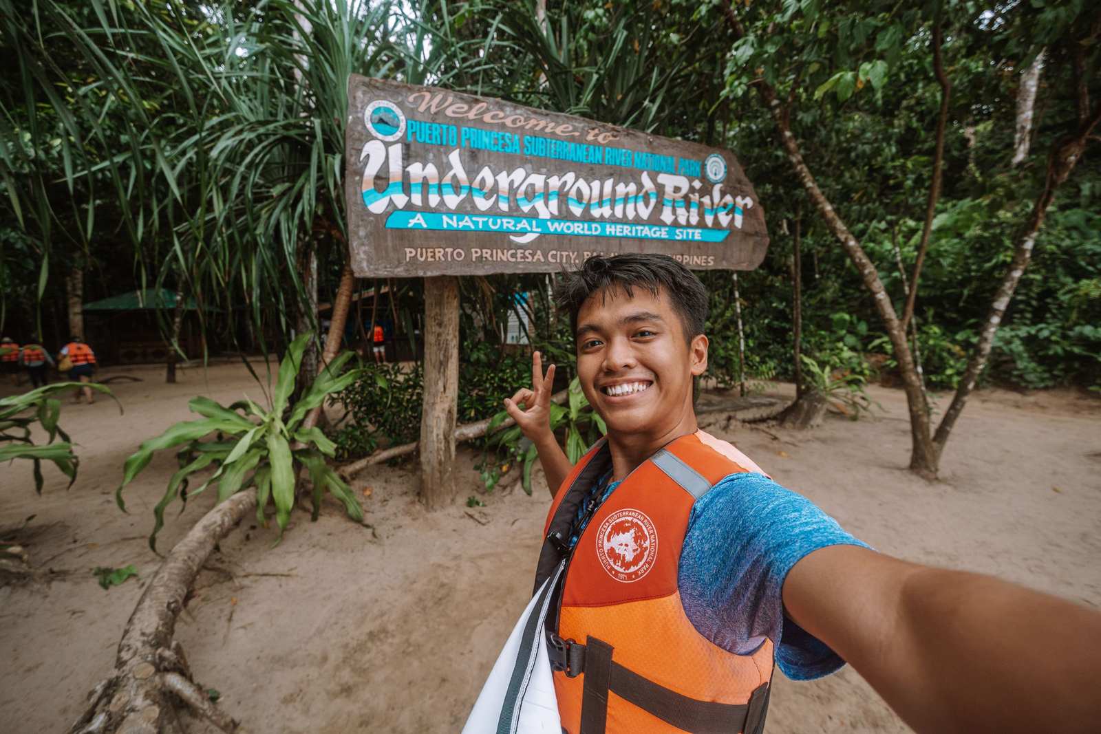 Visitor at the Puerto Princesa Underground River sign in Palawan